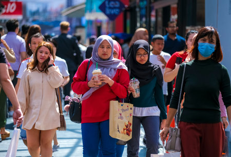 KUALA LUMPUR, MALAYSIA - FEBRUARY 22, 2020 : A crowd of people at Bukit Bintang or Star Hill, a tourist attraction place for shopping, eat and sightseeing.のeditorial素材