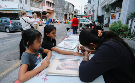 PENANG, MALAYSIA - NOVEMBER 24, 2018 : Tourist visiting old street at Georgetown to enjoy traditional and heritage attractions place.のeditorial素材
