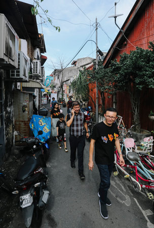 PENANG, MALAYSIA - NOVEMBER 24, 2018 : Tourist visiting old street at Georgetown to enjoy...