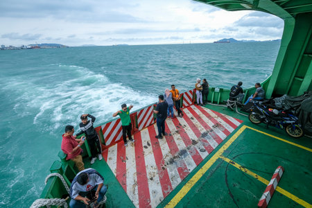 PENANG, MALAYSIA - FEBRUARY 15, 2020 : The famous Penang Ferry. Its carring passengers including car and motorcycle cruising between mainland and Island. Ferry is one of Penang tourism attractions.のeditorial素材