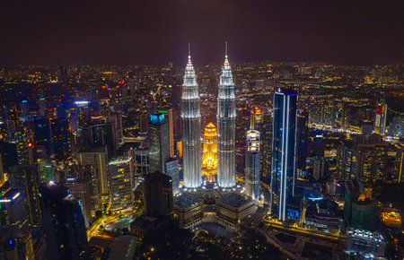 KUALA LUMPUR, MALAYSIA - MARCH 25, 2020 : Aerial view of Kuala Lumpur city center skyline with Petronas KLCC Twin Towers and surrounding building at night.のeditorial素材