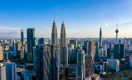 KUALA LUMPUR, MALAYSIA - MARCH 25, 2020: Aerial view of Kuala Lumpur city center skyline with Petronas KLCC Twin Towers and surrounding building in the evening.のeditorial素材