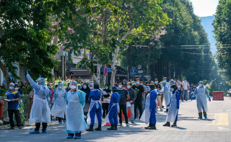 KUALA LUMPUR, MALAYSIA - APRIL 19, 2020: Medical personnel helps the public to do the COVID-19 test to taking nasal and mouth swab at Kampung Baru. Coronavirus disease 2019 (COVID-19) outbreak.のeditorial素材