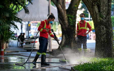 KUALA LUMPUR, MALAYSIA - APRIL 19, 2020: City cleaner worker still working during Movement Control...