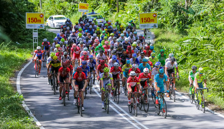 KEDAH, MALAYSIA - FEBRUARY 26, 2016: Riders compete during Le Tour de Langkawi (LTDL) 2016. LTDL is a multiple-stage bicycle race held in Malaysia.のeditorial素材