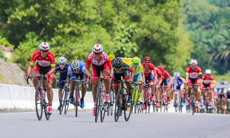 PERAK, MALAYSIA - FEBRUARY 25, 2016: Riders compete during Le Tour de Langkawi (LTDL) 2016. LTDL is a multiple-stage bicycle race held in Malaysia.のeditorial素材