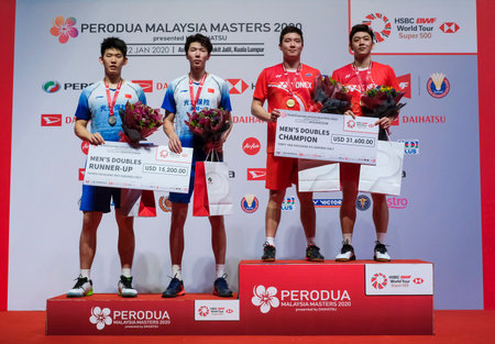 KUALA LUMPUR, MALAYSIA - JANUARY 12, 2020 : Kim Gi Jung and Lee Yong Dae of Korea in action during Men's Doubles badminton tournament, Perodua Malaysia Masters 2020 at the Axiata Arena.のeditorial素材