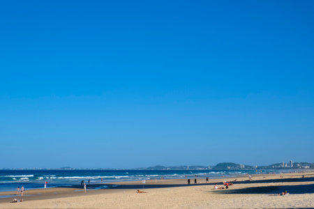 GOLD COAST, AUSTRALIA - APRIL 16, 2018: Beautiful weather and wonderful beaches at Surfers Paradise. One of the main tourist destination at Gold Coast.のeditorial素材