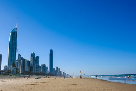 GOLD COAST, AUSTRALIA - APRIL 16, 2018:  High-rise skyline and Surfers Paradise Beach with beautiful weather. One of the main tourist destination at Gold Coast.のeditorial素材
