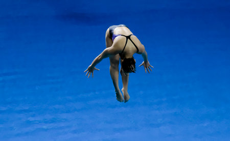 GOLD COAST, AUSTRALIA - APRIL 13, 2018: Athlete competes in the Women's 1m Springboard Diving Final of the Gold Coast 2018 Commonwealth Games.のeditorial素材