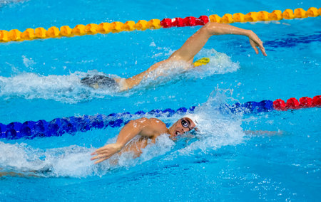 GOLD COAST, AUSTRALIA - APRIL 05, 2018: Athlete swimming during 2018 Gold Coast Commonwealth Games at Gold Coast Aquatic Centre.のeditorial素材