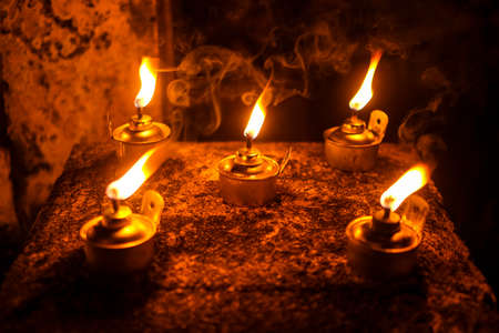 Malay tradition kerosene oil lamp or pelita selective focus during Hari Raya Aidilfitri celebration....