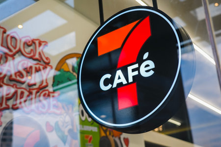 KUALA LUMPUR, MALAYSIA - MAY 22, 2023: The signboard of 7Cafe, 7 Eleven store. 7-Eleven Inc. is a Japanese-American international chain of convenience stores.のeditorial素材