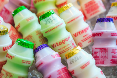 KUALA LUMPUR, MALAYSIA - JUNE 22, 2023: Vitagen bottles in a cold ice tray. Vitagen is a probiotic beverage cultured milk and good for a healthy digestive system.のeditorial素材