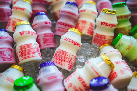 KUALA LUMPUR, MALAYSIA - JUNE 22, 2023: Vitagen bottles in a cold ice tray. Vitagen is a probiotic beverage cultured milk and good for a healthy digestive system.のeditorial素材