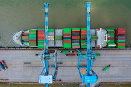 KLANG, MALAYSIA - OCTOBER 27, 2023:  International import-export containers cargo ship at Westports, Port Klang. Westports serves as the main gateway for container and conventional cargo.のeditorial素材