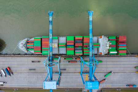 KLANG, MALAYSIA - OCTOBER 27, 2023:  International import-export containers cargo ship at Westports,...