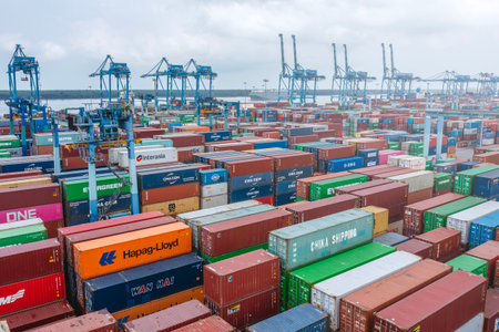 KLANG, MALAYSIA - OCTOBER 27, 2023:  International import-export containers cargo ship at Westports, Port Klang. Westports serves as the main gateway for container and conventional cargo.のeditorial素材