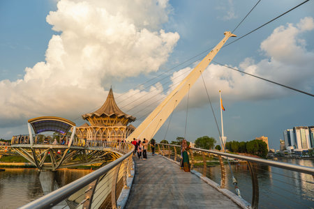 SARAWAK, MALAYSIA - SEPTEMBER 16, 2023: Tourists and locals enjoying the Sarawak River sunset view at Kuching Waterfront. One of the popular tourist attractions in Sarawak.のeditorial素材