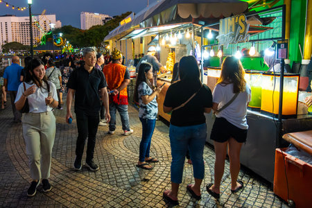 SARAWAK, MALAYSIA - SEPTEMBER 16, 2023: Tourists and locals walk along the night market at Kuching Waterfront. One of the popular tourist attractions in Sarawak.のeditorial素材