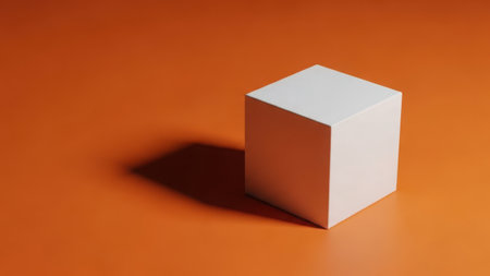 A single white cube isolated on a brown background with a shadowの素材