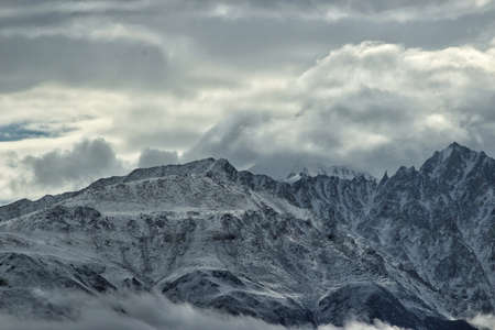 I took this shot of mountain peak covered in dense clouds from the neighboring peak of Khardung La mountain at an altitude of 18380ft.のeditorial素材