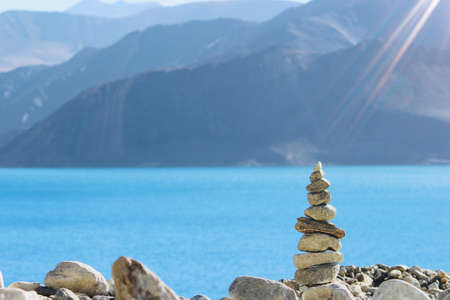 This is a perspective shot of pebble stones in front of Pangong Lake, India.のeditorial素材
