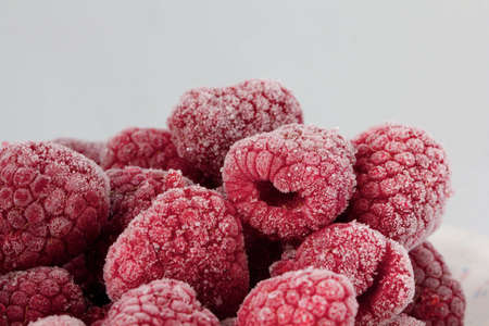 Frozen rasberries / Gefrorene Himbeerenの写真素材