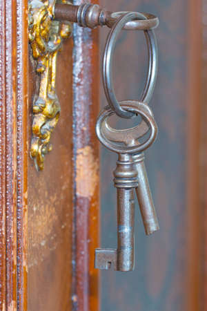 Broken key on antique lockの写真素材