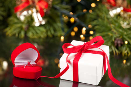 Engagement Diamond ring in a red box and present の写真素材