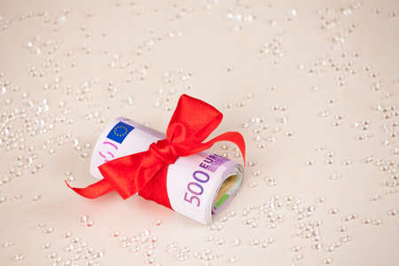 Red ribbon on five hundred Euro banknotesの写真素材
