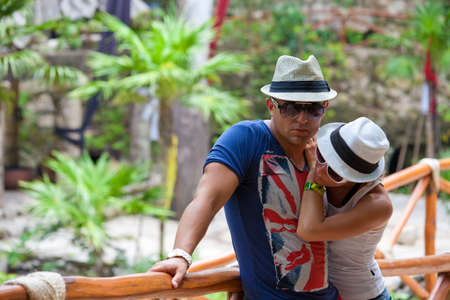 Tired young couple in tropical park after excursion, Mexicoの写真素材