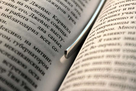 Metal Bookmark between two pages in the bookの写真素材