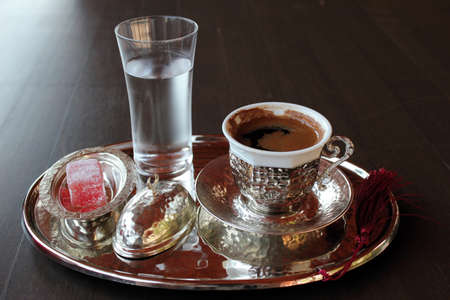 Cup of coffee with a glass of waterの写真素材