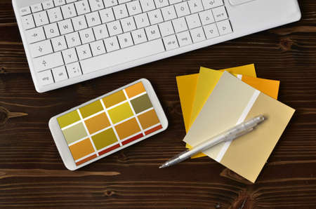 Color samples cmyk on black keyboard
