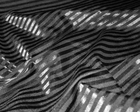 Background of black silk with stripesの写真素材
