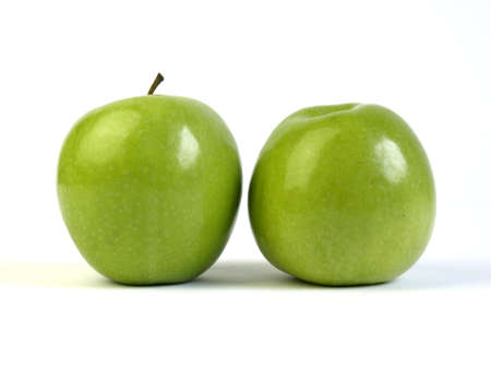 Two green apples on white backgroundの写真素材