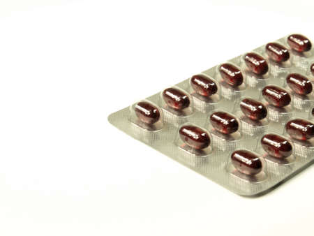 Red pills on white backgroundの写真素材