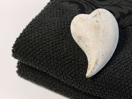Black towels with a heartの写真素材