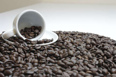 Cup with espresso beans