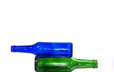 Green and blue bottles on whiteの写真素材