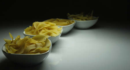 Pasta in white bowlsの写真素材