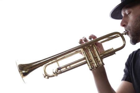 A man is playing trumpet on a white backgroundの写真素材