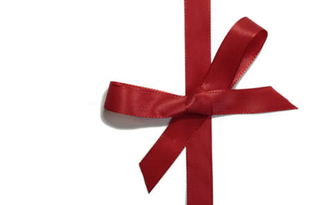 Red ribbon on a white backgroundの写真素材