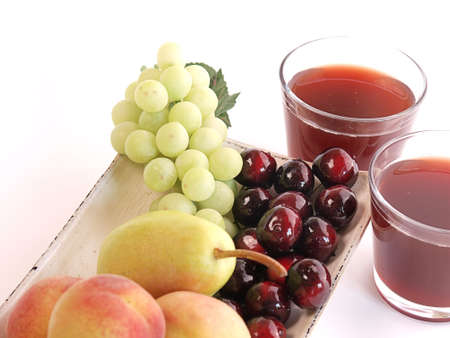 Fresh fruits and two glasses of juice