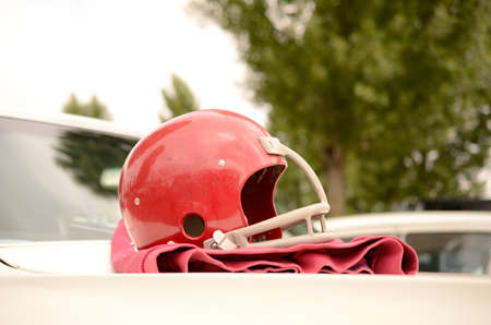 Football helmet on an American vintage carの写真素材
