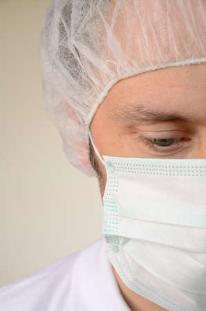 Mature male looking down at hospital, close up shotの写真素材