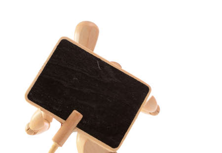 Wooden man holding a blackboard with space for textの写真素材