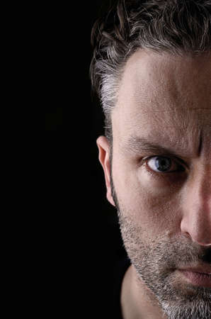 Sceptical man on a black background