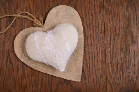 White heart shape on a wooden oak backgroundの写真素材